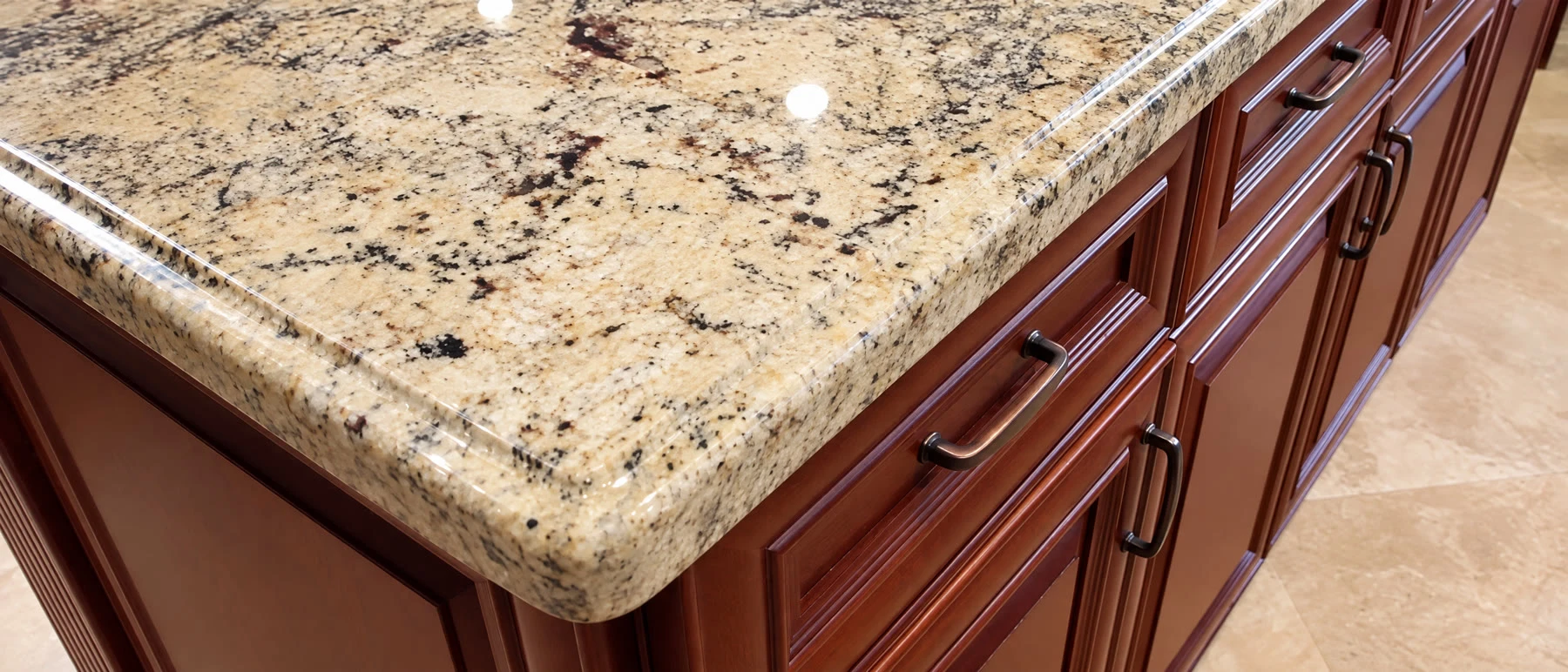 Quartz vs Granite vs Marble: Best Countertop for Plantation Kitchens 2 Polished granite countertop edge over cherry cabinets in a Pembroke Pines kitchen