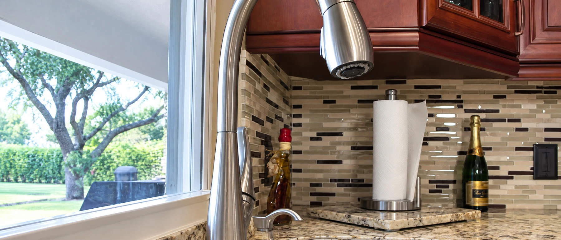 Quartz vs Granite vs Marble: Best Countertop for Plantation Kitchens 1 Granite countertops and cherry cabinets in a Pembroke Pines kitchen remodel by Fresh Remodel